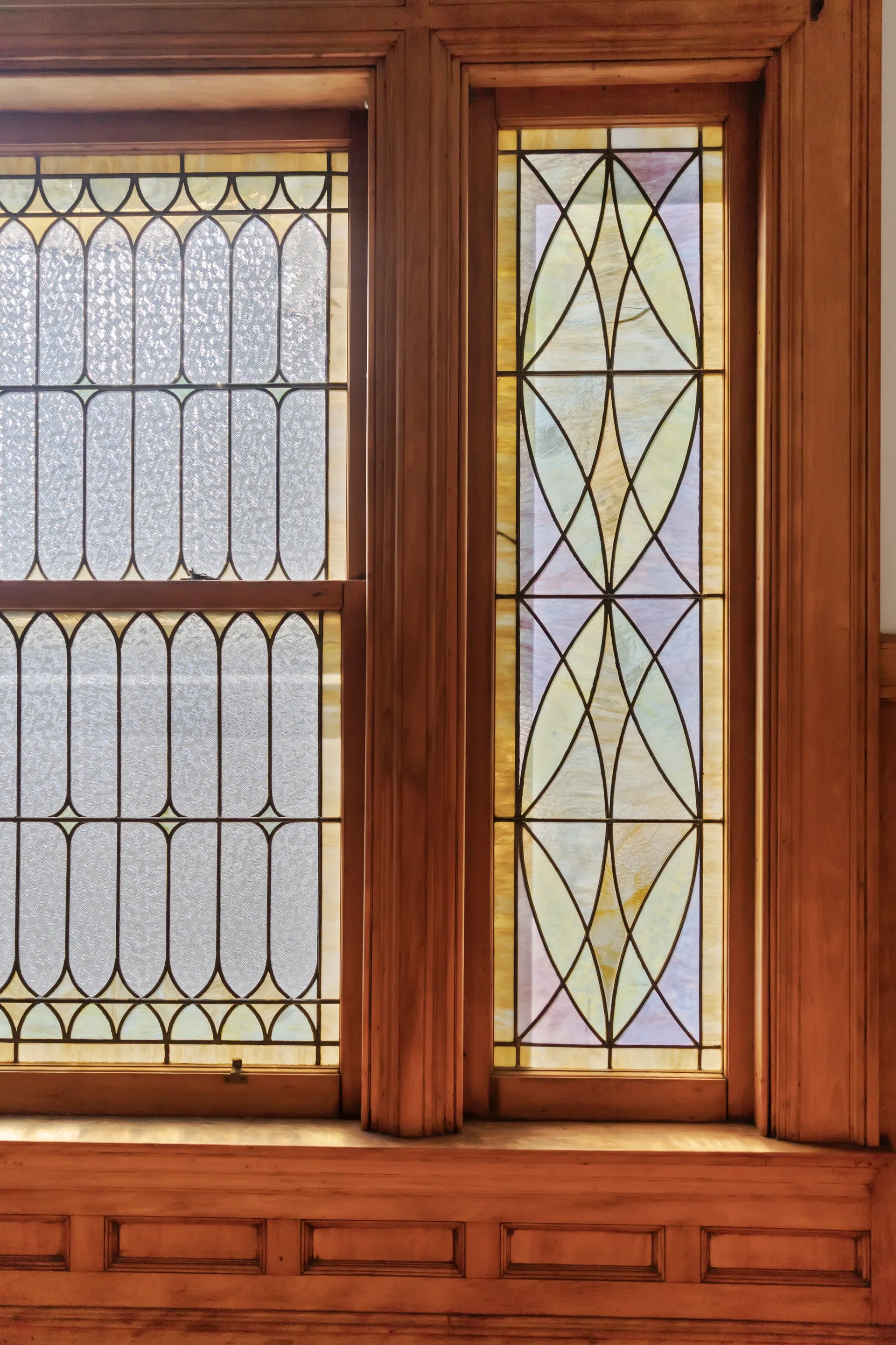 Original leaded and stained-glass windows in wood casings at 62 Fuller Street before renovation