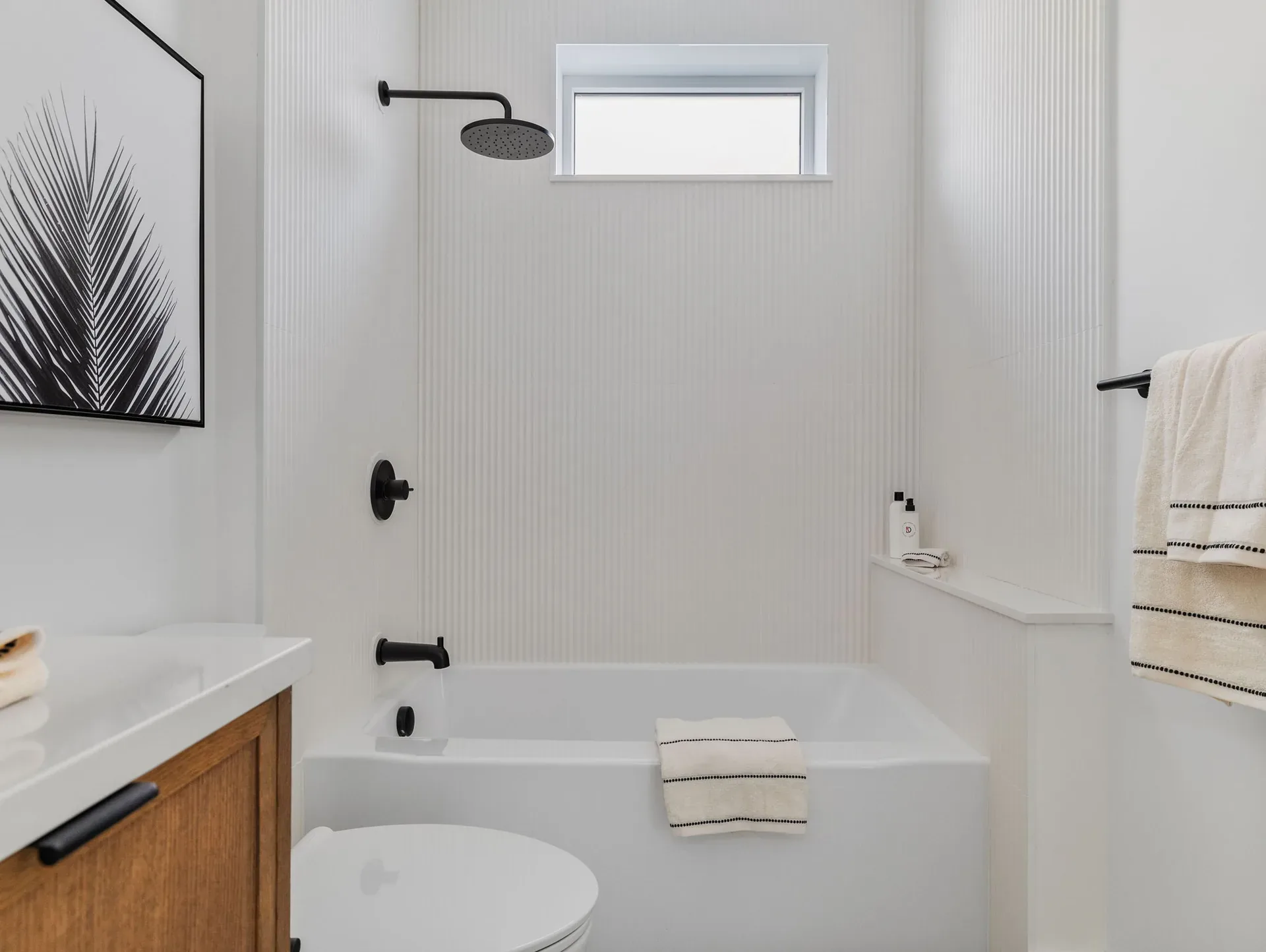 Contemporary bathroom with matte-black fixtures