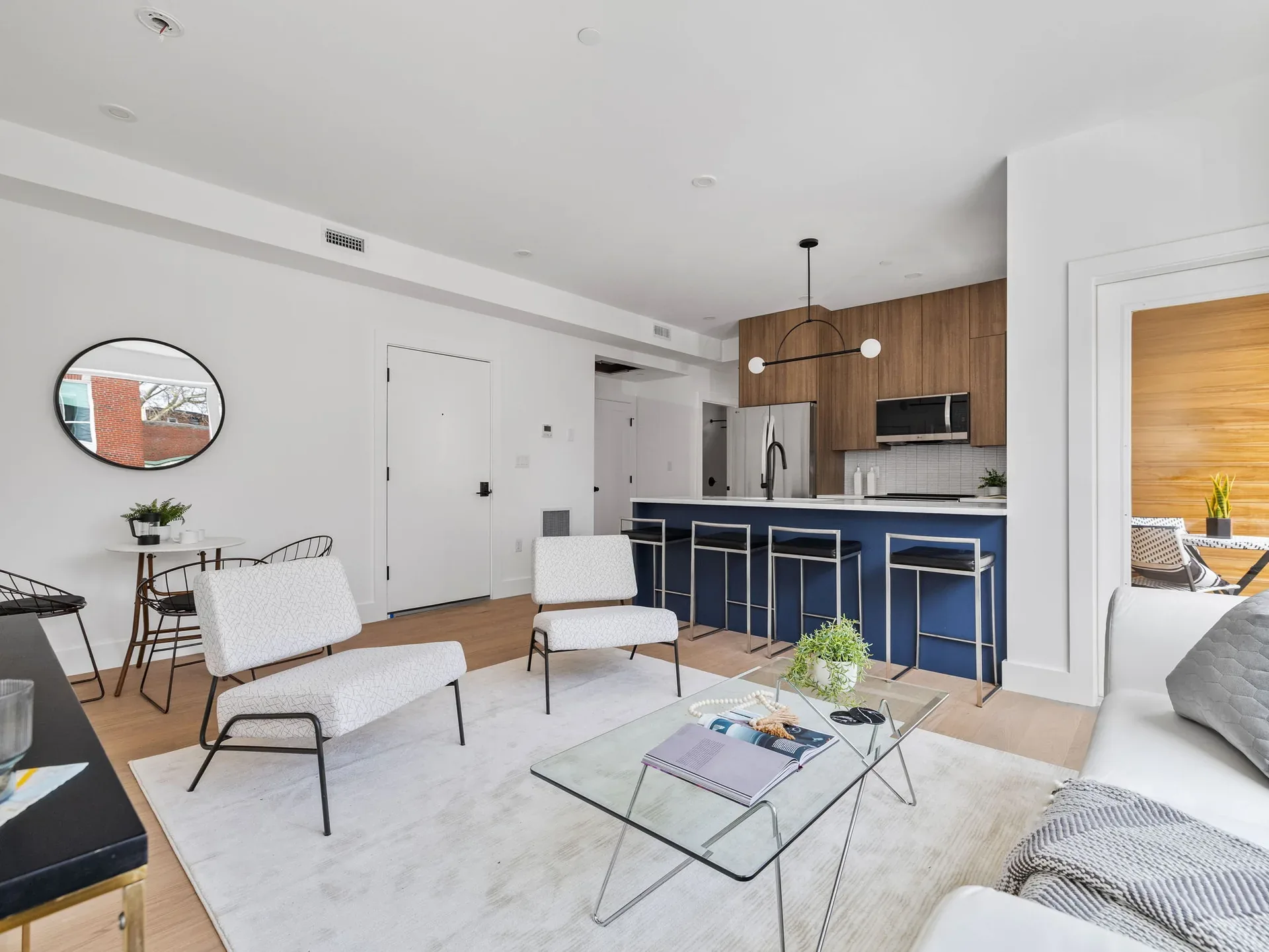 Staged open-plan living room and kitchen at The Parkline