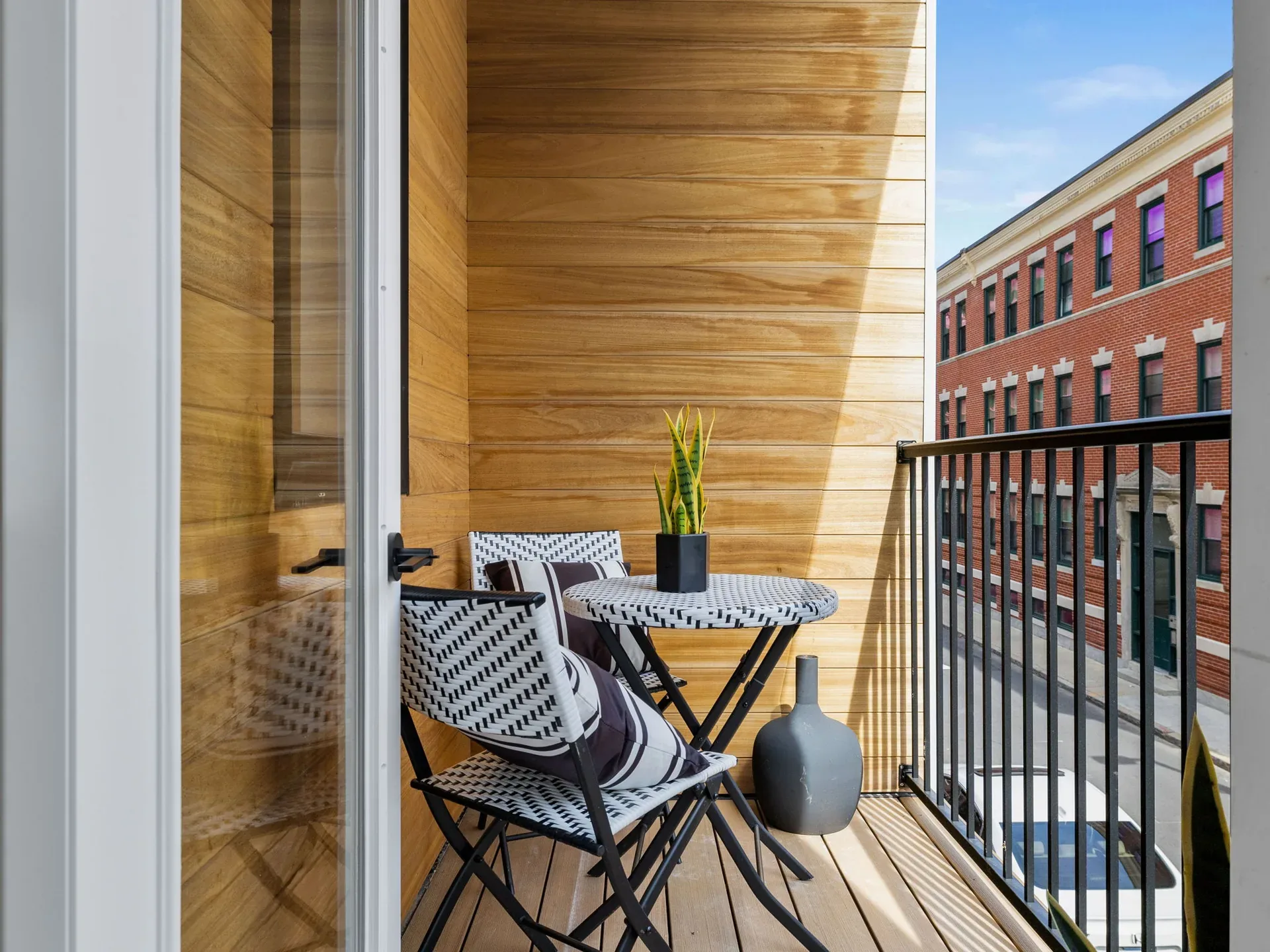Private wood-lined balcony overlooking the neighborhood